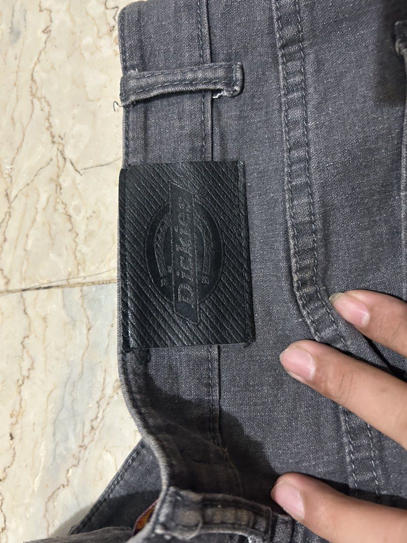 Dickies Grey Denim Jeans (Category: Jeans) located in Mandaluyong City. Submitted by 0lg2026 (Listing ID 1460691134, Image 1). Description: - Classic grey Dickies jeans - Signature Dickies logo patch on the back - Two back pockets with stitching detail - Button and zip front closure - Ideal for everyday casual wear.