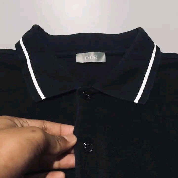Dior Black Polo Shirt with White Trim (Category: Tshirts & Polo Shirts ) located in Calbayog City. Submitted by taking-candy.ph (Listing ID 1460656372, Image 3). Description: - Classic black Dior polo shirt - White piping on collar and sleeves - Small embroidered logo on chest - Button closure at neck - Made in Italy - Size L.