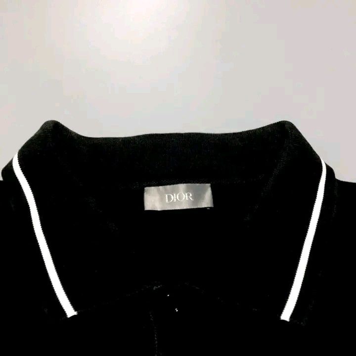 Dior Black Polo Shirt with White Trim (Category: Tshirts & Polo Shirts ) located in Calbayog City. Submitted by taking-candy.ph (Listing ID 1460656372, Image 2). Description: - Classic black Dior polo shirt - White piping on collar and sleeves - Small embroidered logo on chest - Button closure at neck - Made in Italy - Size L.