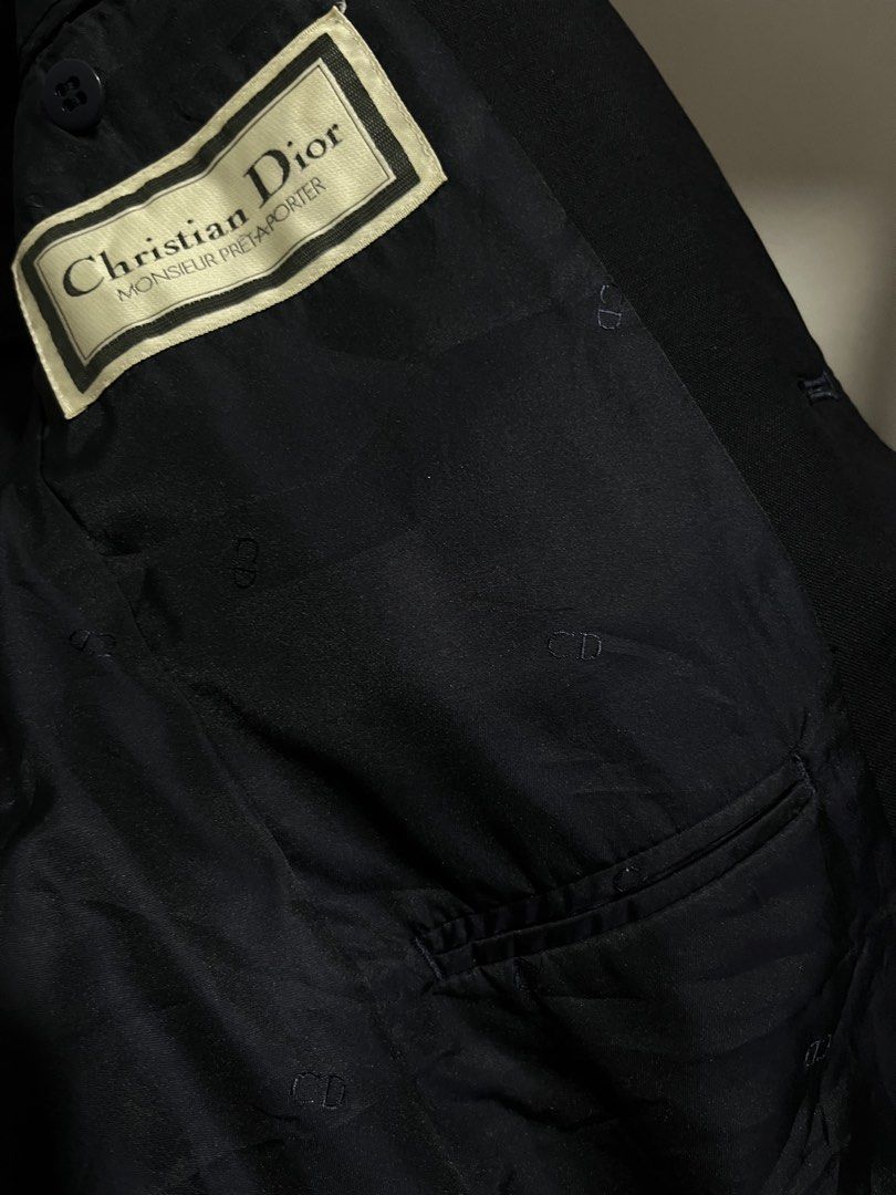 DIOR NAVY BLUE (Category: Coats, Jackets and Outerwear) located in Taguig. Submitted by vm.co (Listing ID 1460266139, Image 3). Description: Perfect for: * Corporate office wear * Business travel * Smart casual outfits * Rainy or cool weather * Capsule wardrobe * Everyday sophisticated styling Condition: Appears to be in very good preloved condition with no visible major stains, tears, or discoloration in the photo. A light steam will give it a c