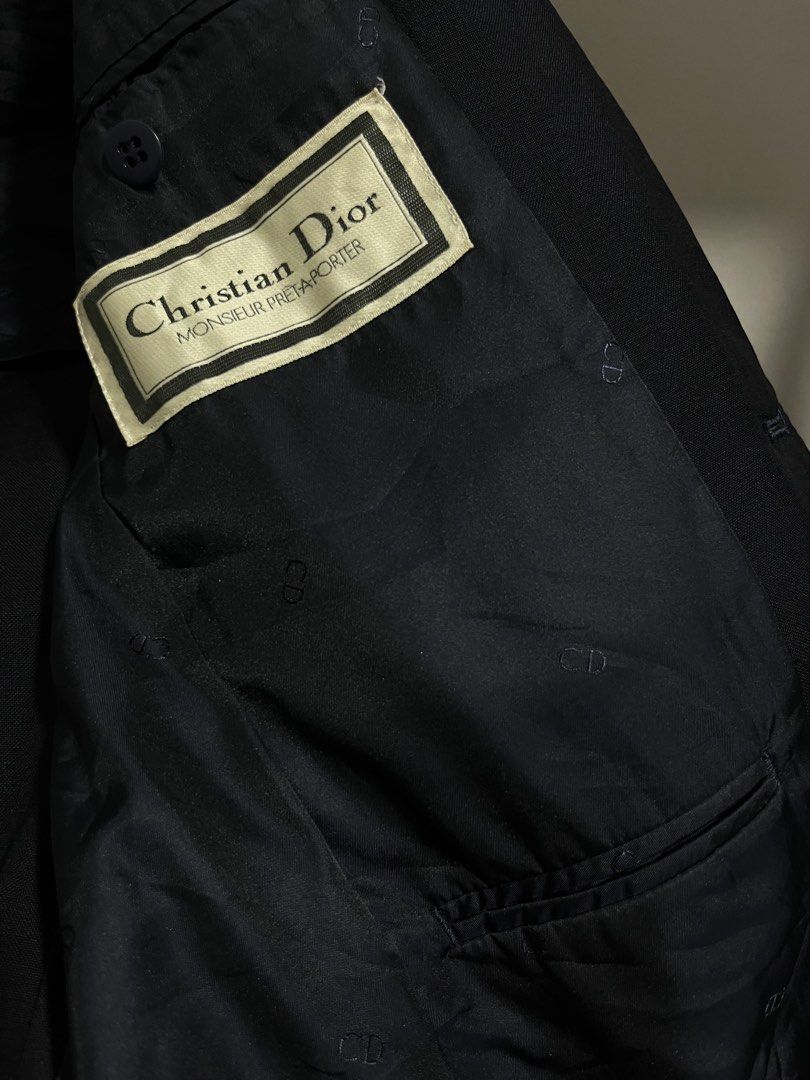 DIOR NAVY BLUE (Category: Coats, Jackets and Outerwear) located in Taguig. Submitted by vm.co (Listing ID 1460266139, Image 2). Description: Perfect for: * Corporate office wear * Business travel * Smart casual outfits * Rainy or cool weather * Capsule wardrobe * Everyday sophisticated styling Condition: Appears to be in very good preloved condition with no visible major stains, tears, or discoloration in the photo. A light steam will give it a c