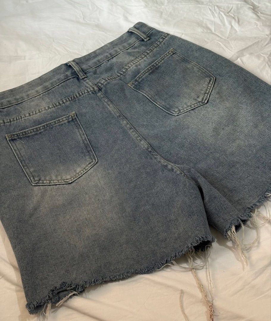 Distressed Denim Jorts (Category: Shorts) located in Manila. Submitted by thedailythreadclub (Listing ID 1460563954, Image 2). Description: - Light wash denim shorts - Ripped detailing on the front - Frayed hem - Classic five-pocket styling - Button and zip closure - Ideal for casual wear.
