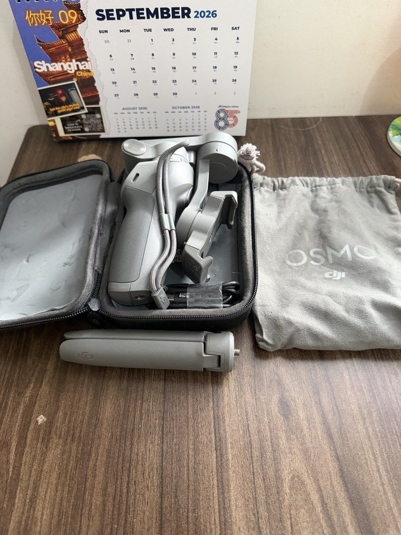 DJI OSMO MOBILE 3 (Category: Gimbals & Stabilizers ) located in Quezon City. Submitted by jianmorata89759 (Listing ID 1460528701, Image 3). Description: RFS: Decluttering Comes with USB A to C cord, pouch, hard case, tripod, and unit. Fully functional with no problems and connects to the DJI APP. Used only twice for testing, price is negotiable.