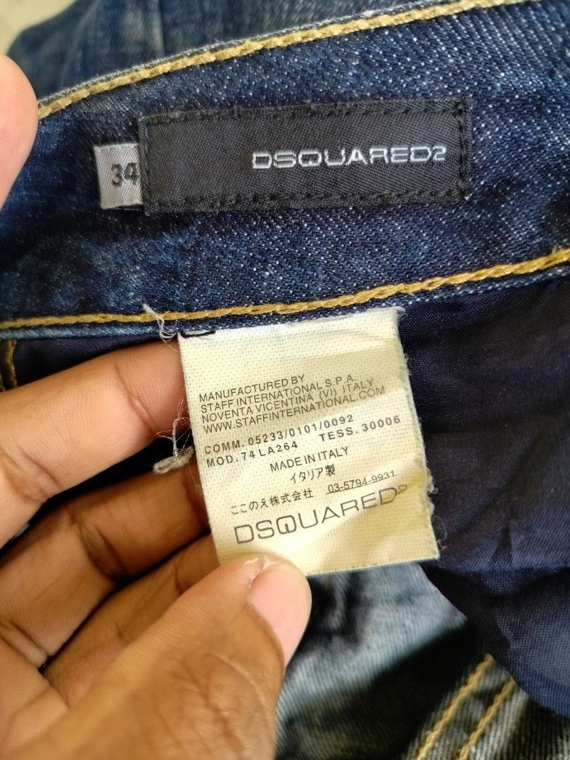 DSQUARED2 Denim Shorts Size 34 (Category: Activewear) located in Manila. Submitted by geraldquinto_917 (Listing ID 1460603752, Image 2). Description: - DSQUARED2 Denim Shorts - Dark Wash Blue - Size 34 - Iconic DSQUARED2 logo with '1964' on back pocket - Distressed detailing on front and back pockets - Button fly closurei - Ideal for casual wear.