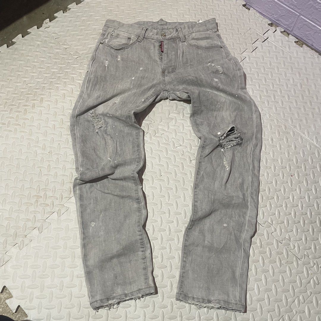 DSQUARED2 Grey Distressed Paint Splatter Denim Jeans (Category: Jeans) located in Zamboanga. Submitted by selvege (Listing ID 1460647265, Image 1). Description: - Grey DSQUARED2 denim jeans - Features paint splatters and distressed details - Button fly closure - Made in Italy -size 30-33 -Excellent condition -no issue.
