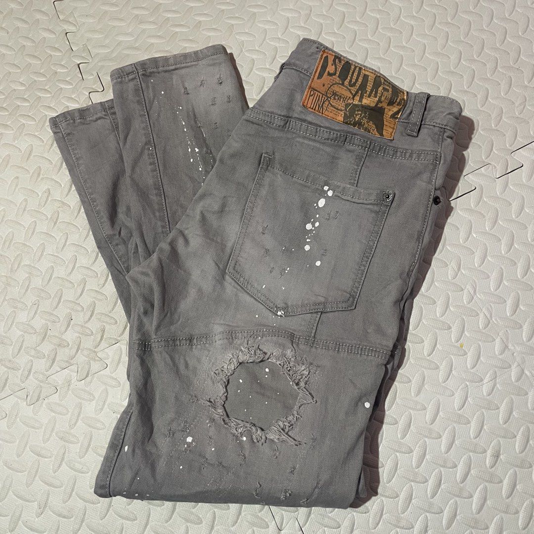 DSQUARED2 Grey Paint Splatter Distressed Denim Jeans (Category: Jeans) located in Zamboanga. Submitted by selvege (Listing ID 1460647928, Image 3). Description: - Grey DSQUARED2 jeans - White paint splatter detail - Distressed and ripped design (front and back) - Unique patchwork on knees and lower legs - Button fly closure - Bold statement piece - size 33-36.