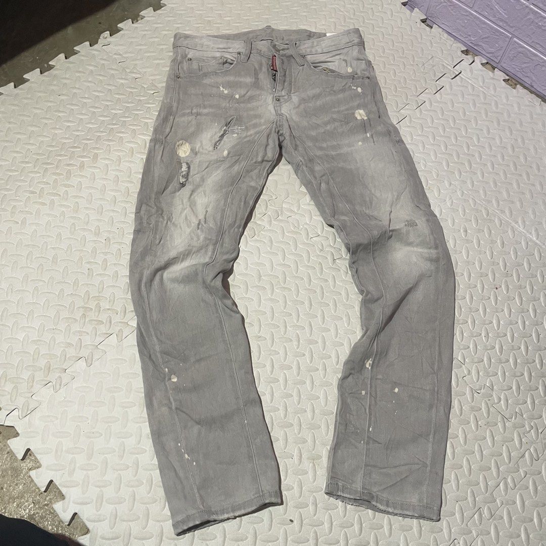 DSQUARED2 Men's Grey Distressed Denim Jeans Size 44 (Category: Jeans) located in Zamboanga. Submitted by selvege (Listing ID 1460645479, Image 1). Description: - Brand: DSQUARED2 - Size: 44 - Color: Grey - Style: Distressed denim with paint splatters and rips - Closure: Button fly - Origin: Made in Italy - Perfect for a casual, edgy aesthetic -excellent no issue -size measurement 30-33.