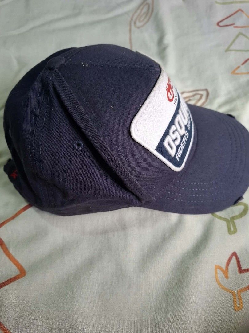 DSQUARED2 Riders Motorcycles Cap Navy Blue (Category: Caps & Hats) located in Quezon City. Submitted by erwinmichael25 (Listing ID 1460576339, Image 2). Description: - Brand: DSQUARED2 - Color: Navy Blue - Design: 'Riders Motorcycles' and 'Services' patch with motorcycle graphic - Embroidery: 'RIDING BEFORE WE COULD WALK' in red on the back - Features: Adjustable strap for a comfortable fit - Origin: Made in China for fast transaction 09171542915