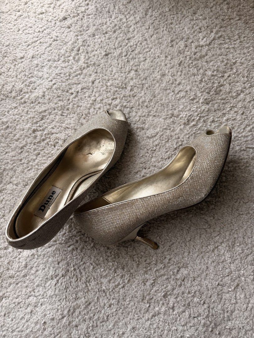 Dune London Peep Toe Glitter Heels (Category: Heels) located in Muntinlupa City. Submitted by pattti_gv (Listing ID 1460539184, Image 1). Description: - Brand: Dune London - Style: Gold glitter peep toe heels - Heel height: Low (comfortable for events) - Condition: Some wear on inside sole and heel - Occasion: Great for parties or a night out.