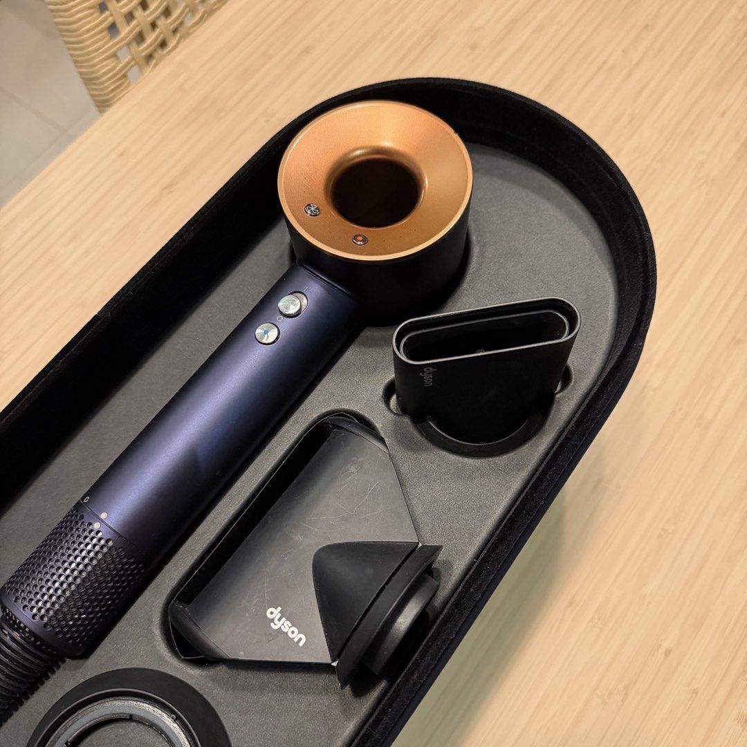 Dyson Supersonic Hair Dryer - Blue/Copper (Category: Hair) located in Taguig. Submitted by Yukandfriends (Listing ID 1460684447, Image 2). Description: - Dyson Supersonic Hair Dryer - Color: Blue & Copper - Includes original attachments: Smoothing nozzle, Styling concentrator, Gentle air attachment - Comes with original storage case - Excellent working condition - Reason for selling: too many hair tools.
