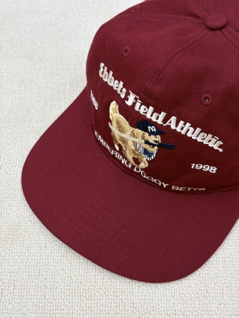 Ebbets Field Athletic Remembering Doggy Betts Cap Burgundy (Category: Caps & Hats) located in Manila. Submitted by porma.market (Listing ID 1460518900, Image 1). Description: - Brand: Ebbets Field Athletic - Color: Burgundy - Design: 'Remembering Doggy Betts' embroidery with dog graphic - Details: '1988' and '1998' accents - Features: Adjustable strap at the back - Interior Tag: American flag and Ebbets Field Athletic branding - Authentic.