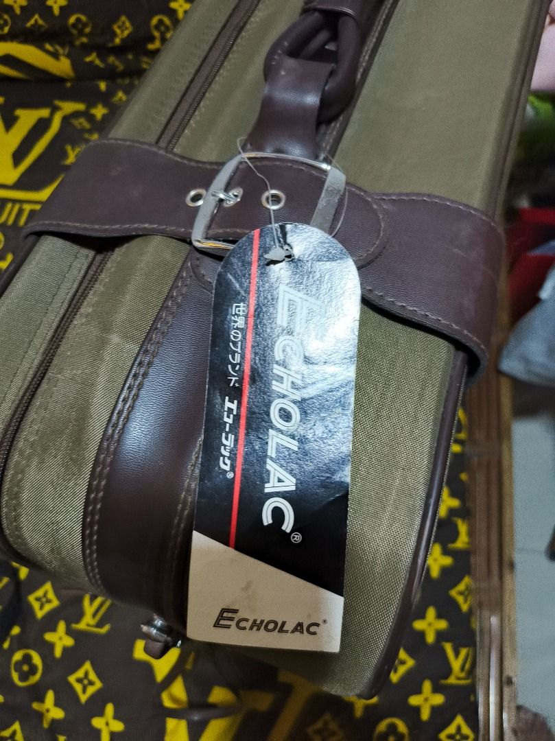 Echolac Suitcase Luggage with Wheels (Category: Luggage) located in San Leonardo. Submitted by burgossanleonardo.12345 (Listing ID 1460684557, Image 1). Description: - Olive green Echolac suitcase - Easy transport with wheels - Comes with small padlock and key - Interior straps to secure belongings - Minor scuffs on exterior, good overall condition - Perfect for your next adventure!.