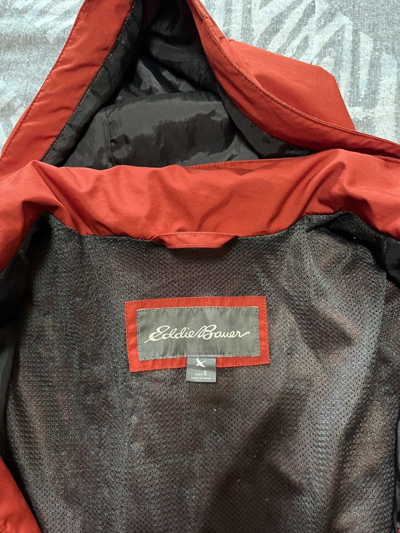 Eddie Bauer Red Orange Hooded Rain Jacket (Category: Coats, Jackets and Outerwear) located in Cainta. Submitted by clopez18 (Listing ID 1460524752, Image 3). Description: - Small size but fits like large - Original Red Eddie Bauer jacket - Features a hood and zipper closure - Two front pockets for convenience - Inner mesh lining for breathability - Ideal for rainy weather and light outdoor activities - Lightweight and easy to pack for travel.