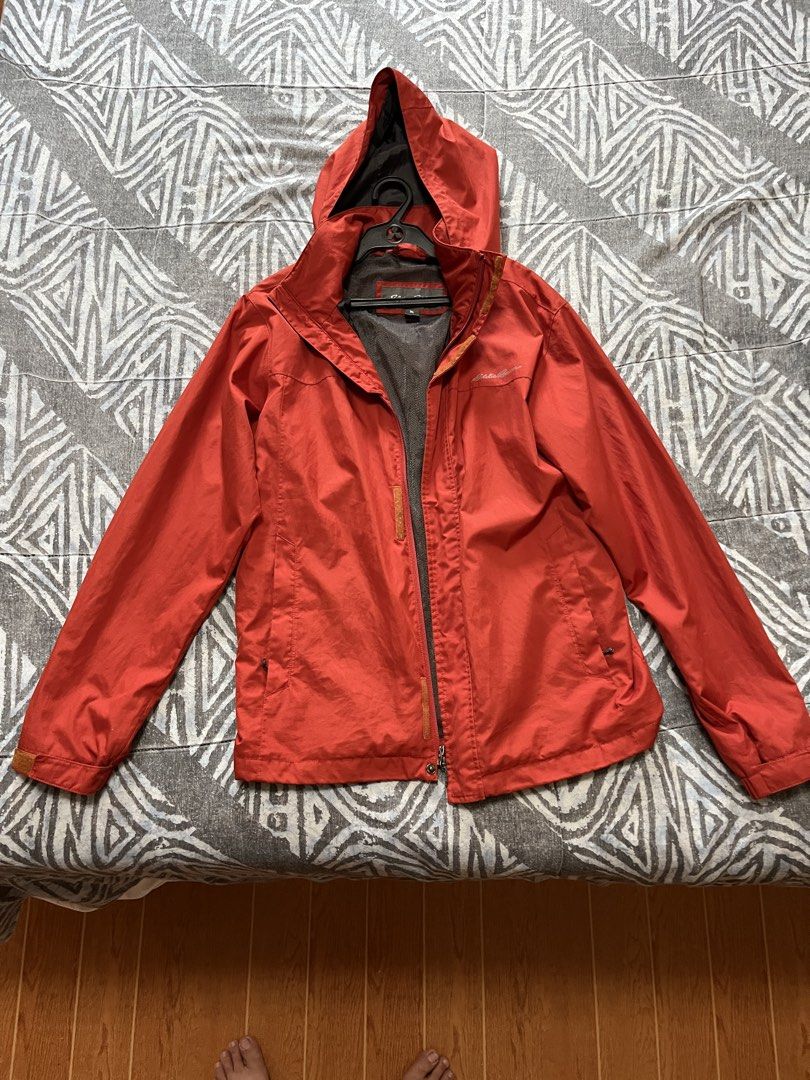 Eddie Bauer Red Orange Hooded Rain Jacket (Category: Coats, Jackets and Outerwear) located in Cainta. Submitted by clopez18 (Listing ID 1460524752, Image 1). Description: - Small size but fits like large - Original Red Eddie Bauer jacket - Features a hood and zipper closure - Two front pockets for convenience - Inner mesh lining for breathability - Ideal for rainy weather and light outdoor activities - Lightweight and easy to pack for travel.