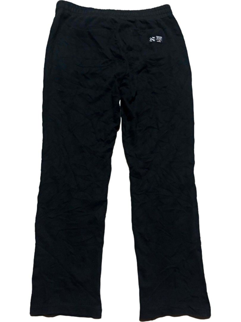 Ellesse Black Track Pants Joggers (Category: Joggers) located in Tubigon. Submitted by 4dos_thrift (Listing ID 1460605453, Image 2). Description: - Brand: Ellesse - Color: Black - Style: Track Pants - Features: Elastic waistband with drawstring - Pockets: Two side pockets - Logo Details: Small Ellesse logo on front left thigh, logo detail on back right pocket - Versatile: Ideal for lounging or workouts.