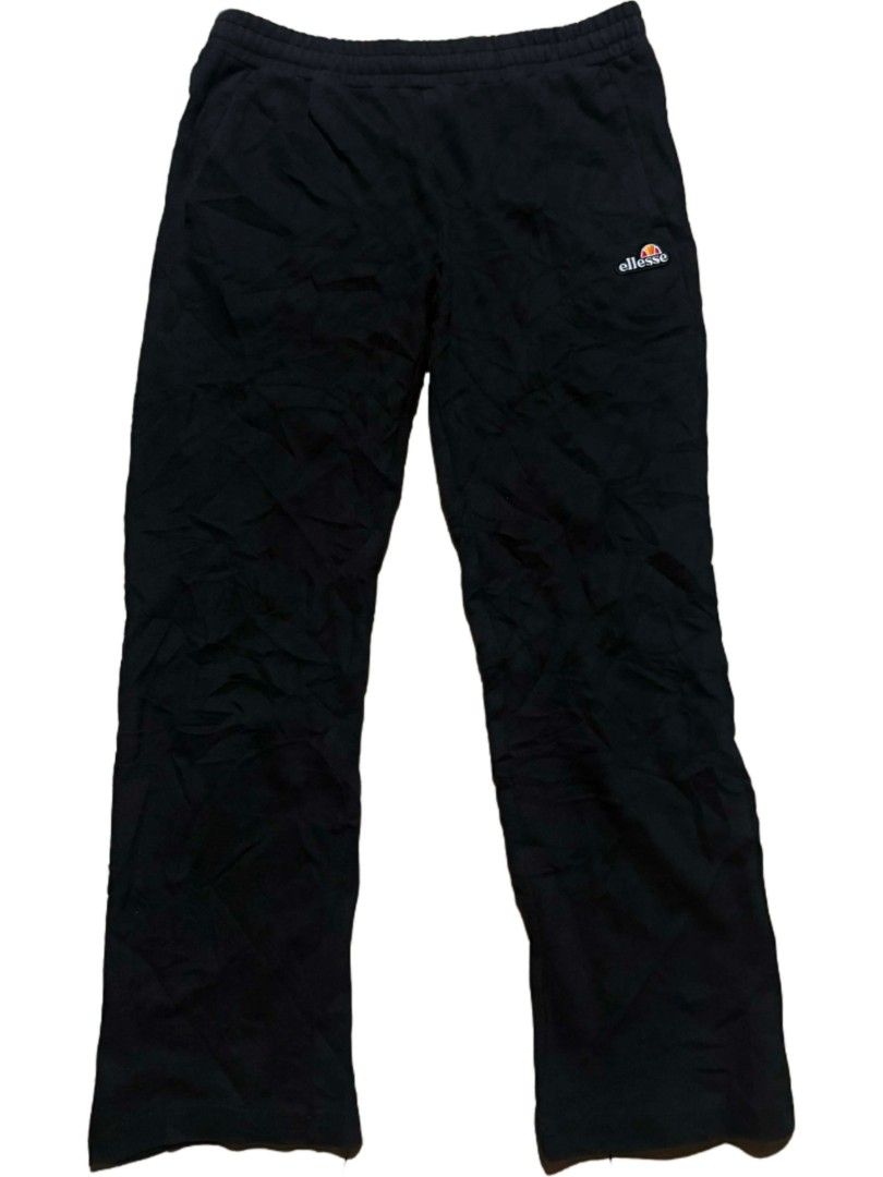Ellesse Black Track Pants Joggers (Category: Joggers) located in Tubigon. Submitted by 4dos_thrift (Listing ID 1460605453, Image 1). Description: - Brand: Ellesse - Color: Black - Style: Track Pants - Features: Elastic waistband with drawstring - Pockets: Two side pockets - Logo Details: Small Ellesse logo on front left thigh, logo detail on back right pocket - Versatile: Ideal for lounging or workouts.