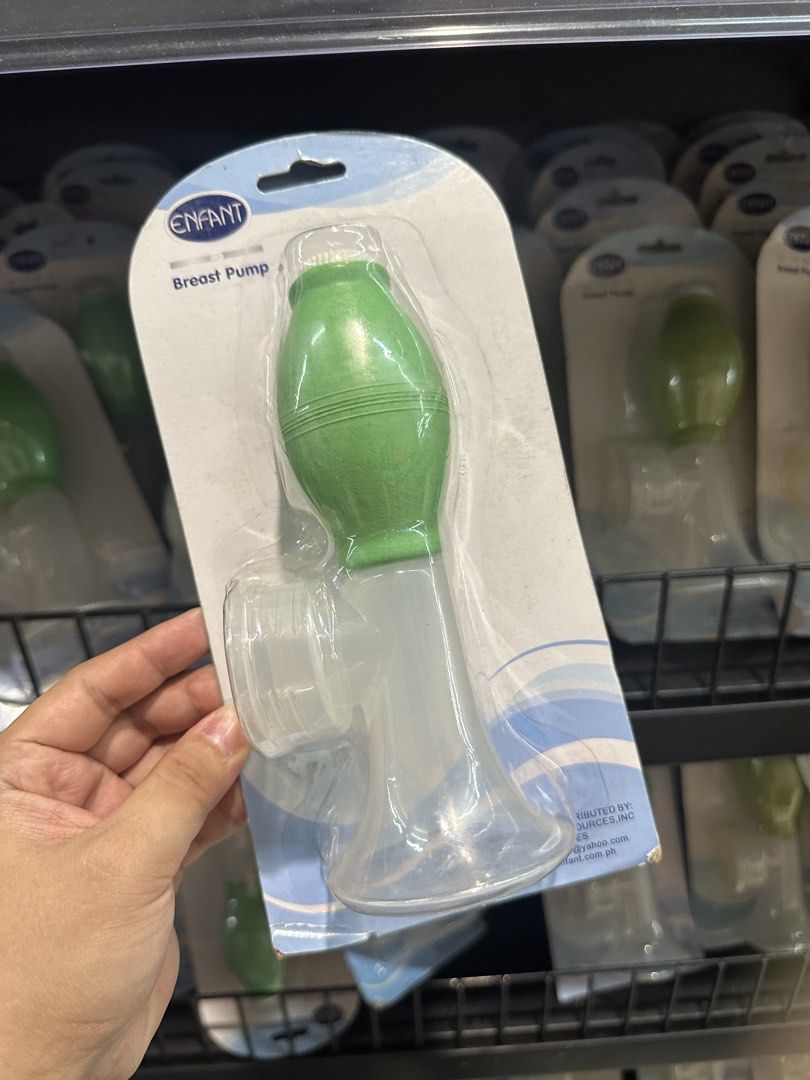 Enfant Breast Pump Manual Handheld (Category: Breastfeeding & Bottle Feeding) located in Manila. Submitted by michaellal91842 (Listing ID 1460593526, Image 1). Description: - Brand: Enfant - Type: Manual Breast Pump - Color: Green and Clear - Condition: Brand new, in original packaging - Features: Easy to use, perfect for collecting breast milk.
