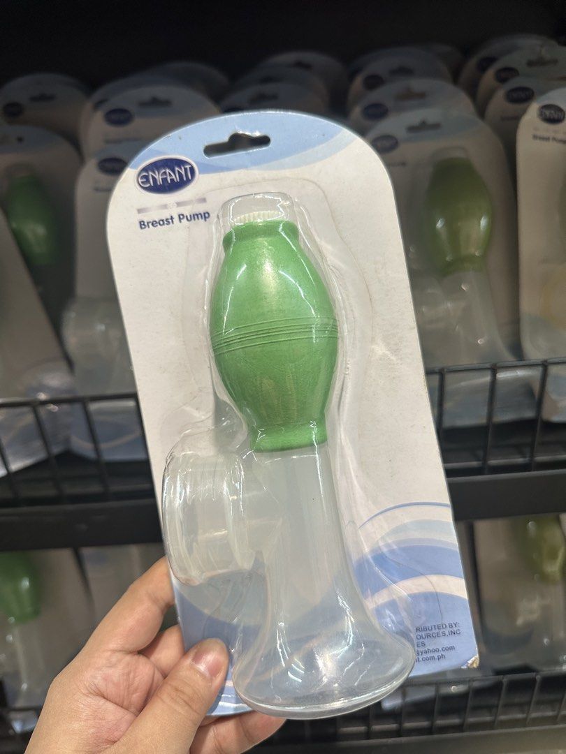 Enfant Breast Pump Manual Handheld (Category: Breastfeeding & Bottle Feeding) located in Manila. Submitted by michaellal91842 (Listing ID 1460593526, Image 2). Description: - Brand: Enfant - Type: Manual Breast Pump - Color: Green and Clear - Condition: Brand new, in original packaging - Features: Easy to use, perfect for collecting breast milk.