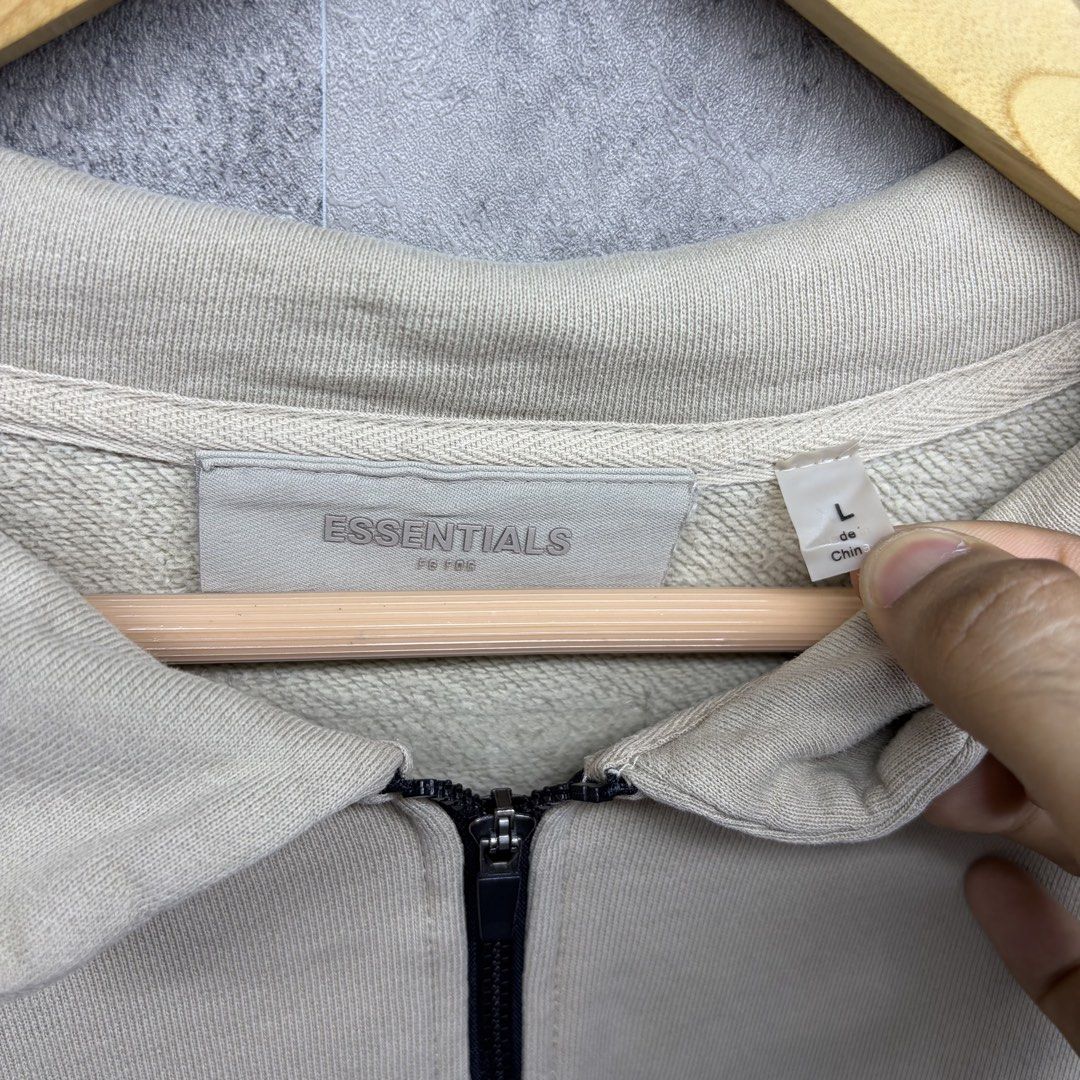 ESSENTIALS (Category: Coats, Jackets and Outerwear) located in Manila. Submitted by ruifinds (Listing ID 1460682839, Image 3). Description: -Fear of God Essentials half-zip sweatshirt cream size: XL width: 26 length: 28 condition: excellent color rate: 8.5/10 issues: minimal crack print sleeve price: 1000 (nego) + plus shipping fee.