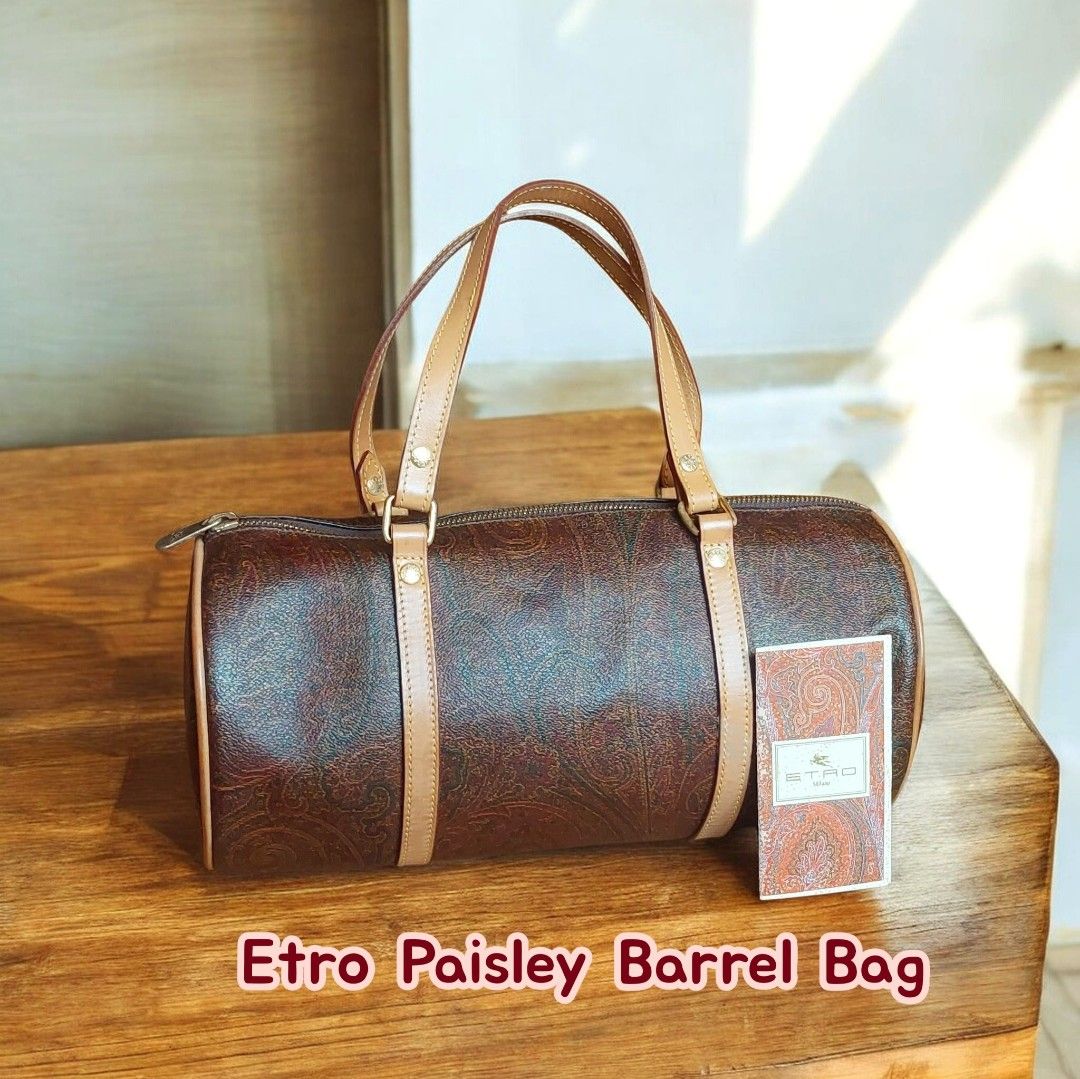 Etro Paisley Barrel Bag (Category: Luxury Bags & Wallets) located in Davao. Submitted by wengbagstuff (Listing ID 1460666117, Image 1). Description: - Classic Etro barrel bag - Signature paisley print - Genuine leather trim and handles - Secure zipper closure - Made in Italy - rank A condition.