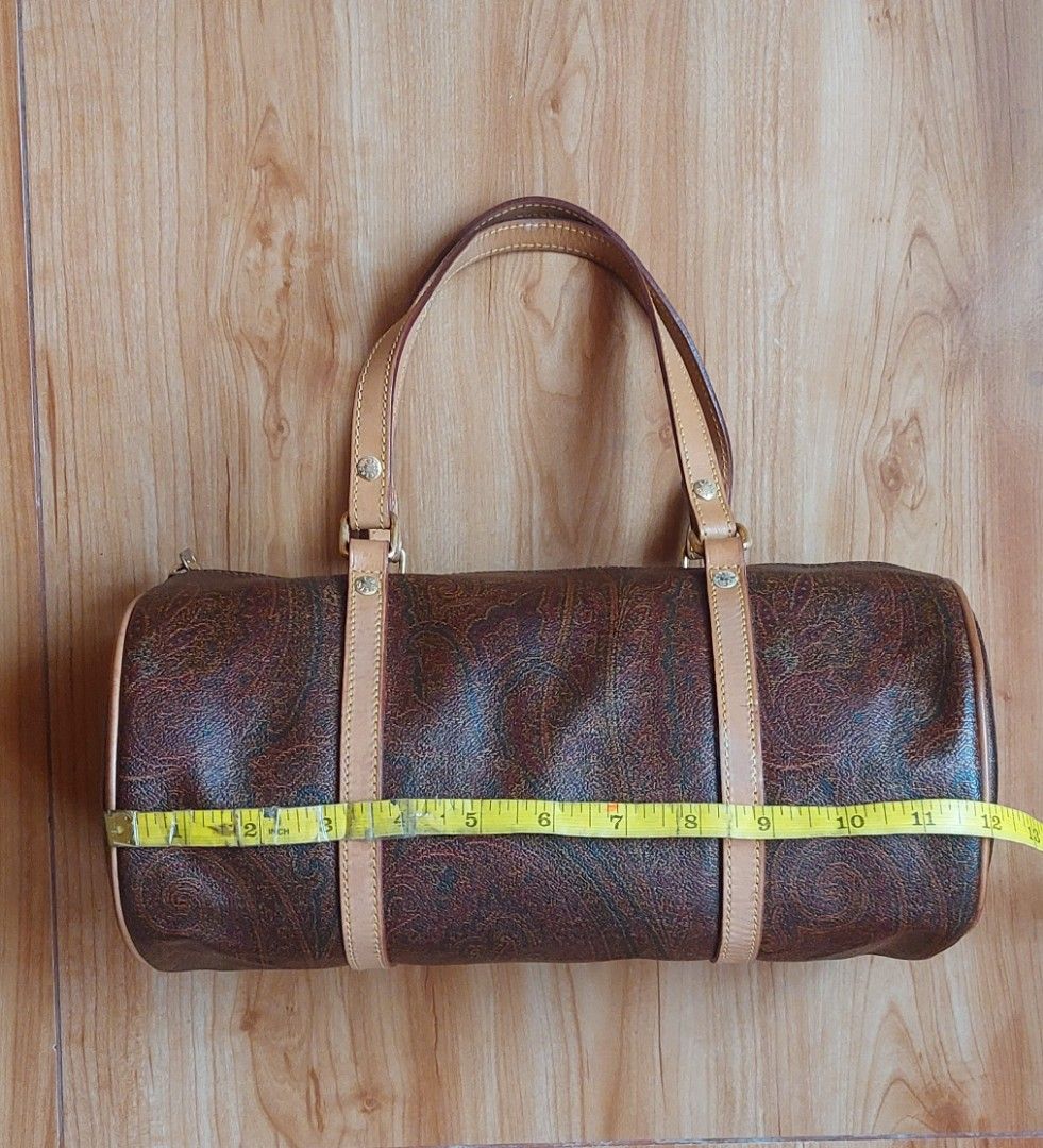 Etro Paisley Barrel Bag (Category: Luxury Bags & Wallets) located in Davao. Submitted by wengbagstuff (Listing ID 1460666117, Image 2). Description: - Classic Etro barrel bag - Signature paisley print - Genuine leather trim and handles - Secure zipper closure - Made in Italy - rank A condition.