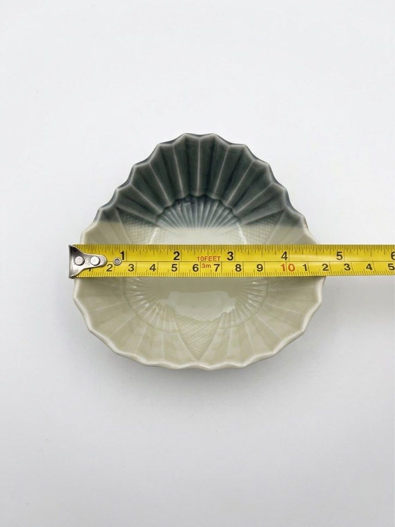 Fan shaped small bowl (Category: Other Kitchenware & Tableware) located in Manila. Submitted by rlab_japan_thrift (Listing ID 1460589353, Image 2). Description: Japanese Fan-Shaped Ceramic Small Bowl Set (Set of 5) 🪭✨ Unique Japanese ceramic small dish/bowl set designed in a traditional folding fan shape (Sensu). Features a striking two-tone charcoal grey and off-white glaze with detailed ribbed fan texture and cross-hatch pattern work. Perfect 