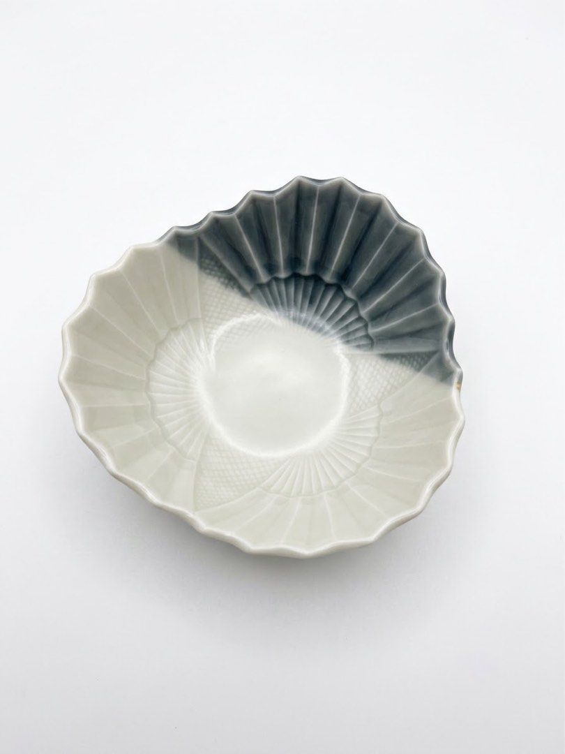 Fan shaped small bowl (Category: Other Kitchenware & Tableware) located in Manila. Submitted by rlab_japan_thrift (Listing ID 1460589353, Image 1). Description: Japanese Fan-Shaped Ceramic Small Bowl Set (Set of 5) 🪭✨ Unique Japanese ceramic small dish/bowl set designed in a traditional folding fan shape (Sensu). Features a striking two-tone charcoal grey and off-white glaze with detailed ribbed fan texture and cross-hatch pattern work. Perfect 