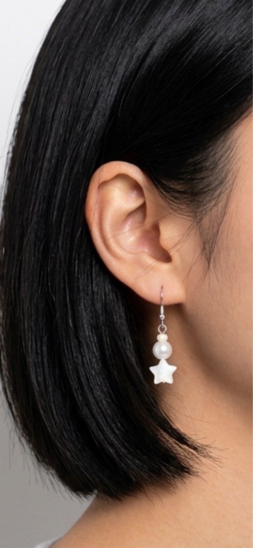 Fancy earrings (Category: Earrings) located in San Juan City. Submitted by cometsanythingtosell (Listing ID 1460545103, Image 1). Description: •4.5cm long •plastic white beads, synthetic pearl and acrylic star.