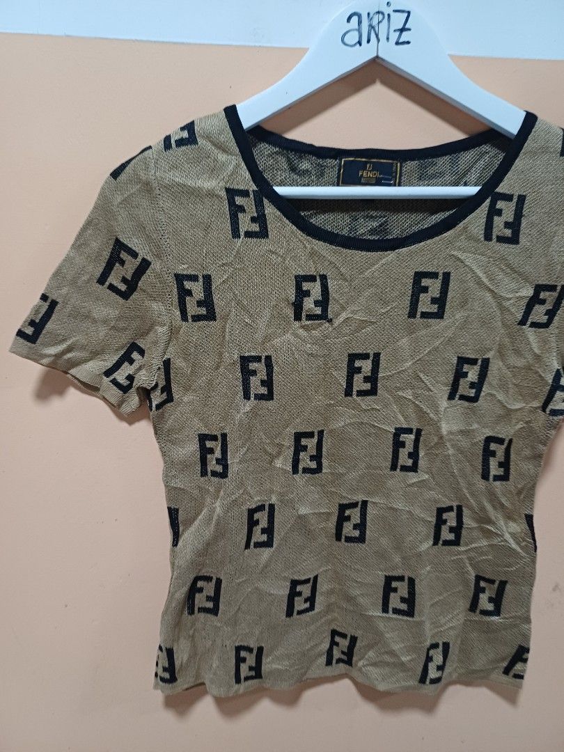 Fendi Knitted Shirt (Category: Luxury Apparel) located in Davao. Submitted by phgrails082 (Listing ID 1460610119, Image 2). Description: Fendi Knitted Shirt size 42 on tag, Med to Large issue pinhole sa sleeve 1,200 add sf.
