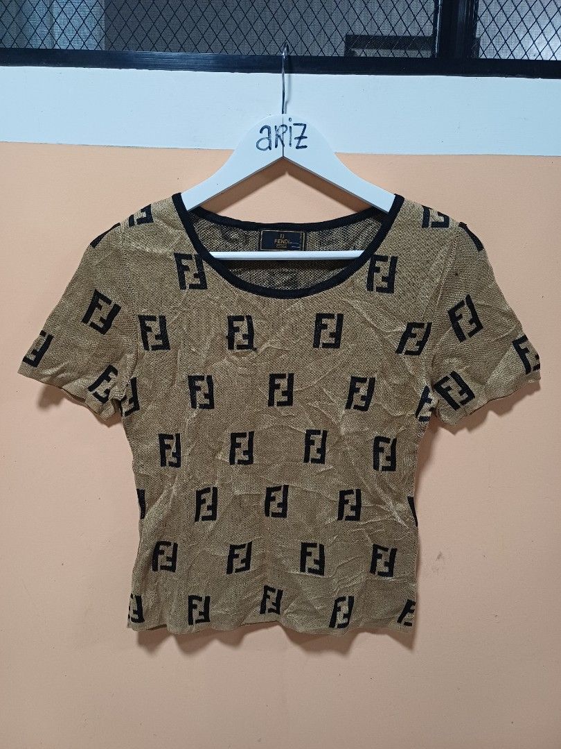 Fendi Knitted Shirt (Category: Luxury Apparel) located in Davao. Submitted by phgrails082 (Listing ID 1460610119, Image 1). Description: Fendi Knitted Shirt size 42 on tag, Med to Large issue pinhole sa sleeve 1,200 add sf.