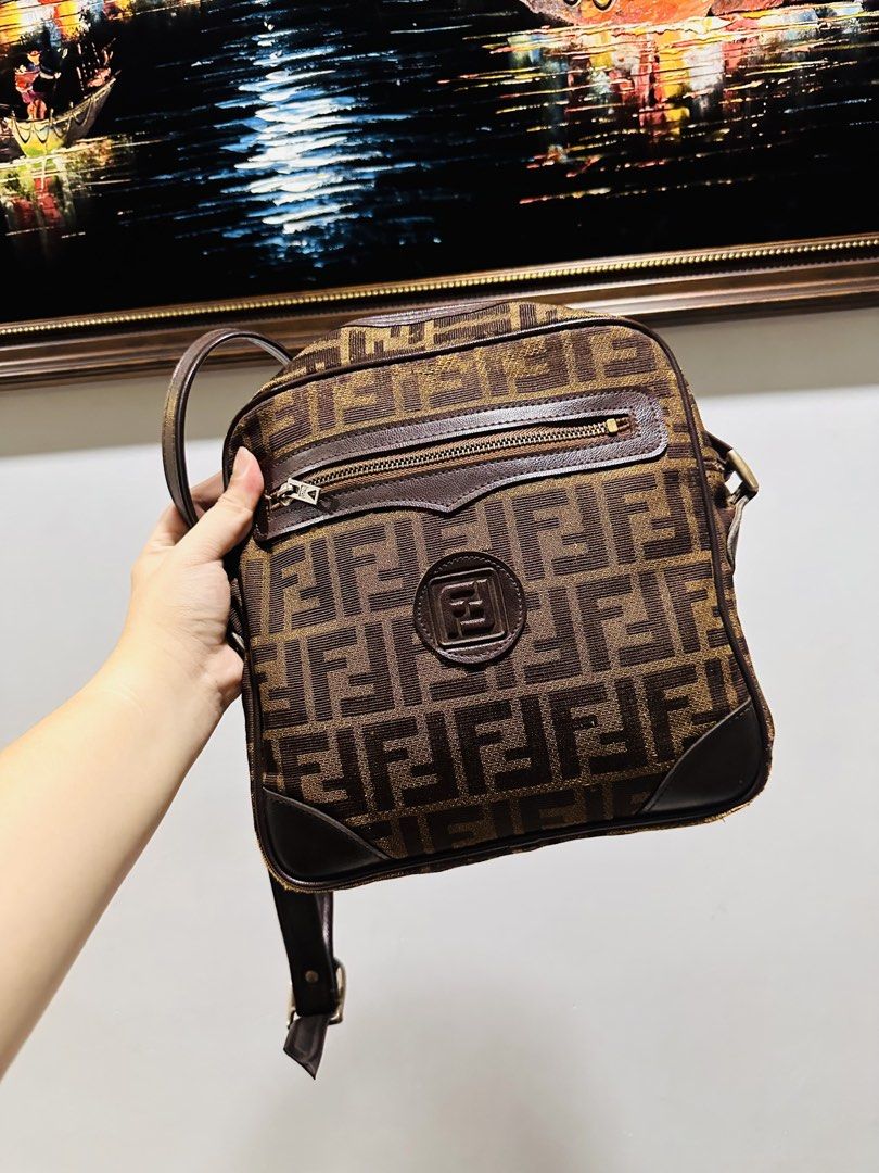 Fendi Zucca FF logo Sling bag (Category: Luxury Bags & Wallets) located in Batangas. Submitted by stopandshopforluxury (Listing ID 1460519871, Image 1). Description: Guaranteed Original 💯 With sign of use; Rubes on corners, no inner lining. What you see is what you get. Shipping via Lalamove, J&T, and LBC Disclaimer: This is a preloved bag. Actual condition is shown in photos. Expect normal signs of wear. Colors may slightly vary due to lighting