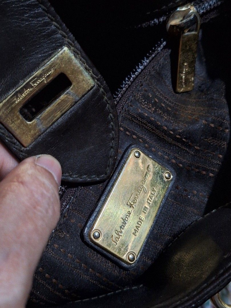 Ferragamo Vintage Sling bag (Category: Other Accessories) located in Quezon City. Submitted by cloudymay (Listing ID 1460507584, Image 3). Description: - Authentic Ferragamo vintage sling bag - Made in Italy - Genuine leather material - Classic and elegant design - Pre-loved item, showing signs of wear consistent with age - Iconic Ferragamo hardware - Perfect for everyday use or special occasions -Flaw: see closure strap, leather tearing. .