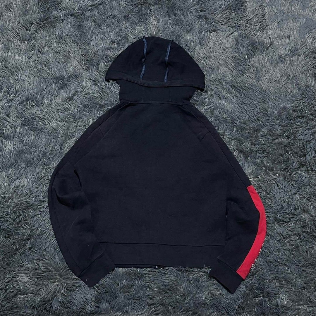 FILA Navy Blue Hoodie Size Medium (Category: Coats, Jackets and Outerwear) located in Batangas. Submitted by jaylord_g (Listing ID 1460659995, Image 2). Description: - Navy blue FILA hoodie - Size: Medium - Red stripe detail on sleeves - Two zippered front pockets - Item needs a wash - Location: Batangas City.