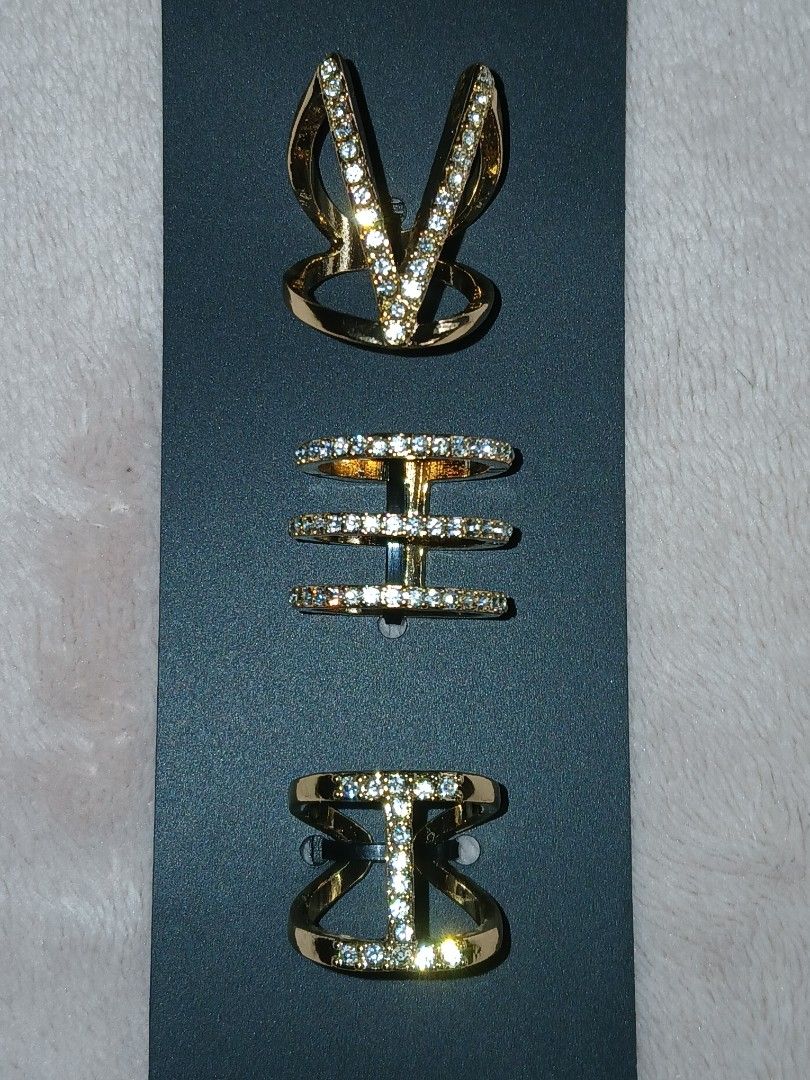 Forever 21 Gold/Clear Rhinestone Ring Set Size 7 (Category: Rings) located in Paranaque City. Submitted by thepennydreadful (Listing ID 1460561735, Image 2). Description: - Set of 3 rings from Forever 21 - Gold tone with sparkling clear rhinestones - Designs include: V-shaped, multi-band, and bow - Comes on original backing card - Original retail price: $9.90.