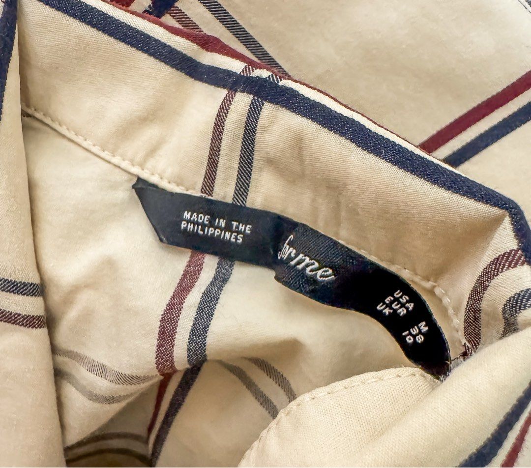 Forme Plaid Button-Up Short Sleeve Shirt (Category: Shirts) located in Manila. Submitted by jemmmandes (Listing ID 1460563315, Image 2). Description: - Cream colored short sleeve shirt - Classic plaid pattern with navy and maroon stripes - Wooden button-up front closure - Proudly made in the Philippines - Ideal for everyday casual wear.
