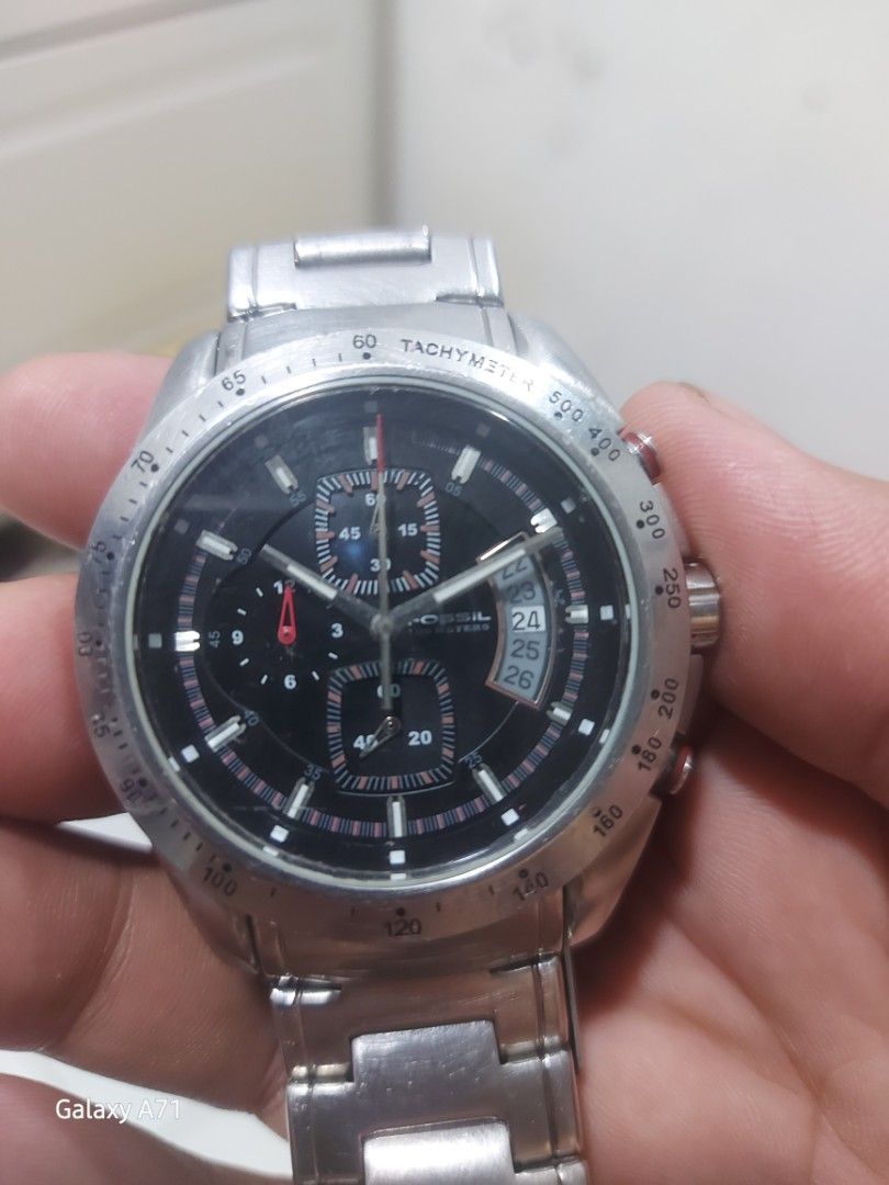 Fossil Chronograph Tachymeter Watch (Category: Men's Watches) located in Naga. Submitted by oddforest_a492eb (Listing ID 1460646206, Image 3). Description: - Fossil Chronograph Watch - Tachymeter Functionality - Black Dial with Date Display - Stainless Steel Band - Minor signs of wear on casing and band.
