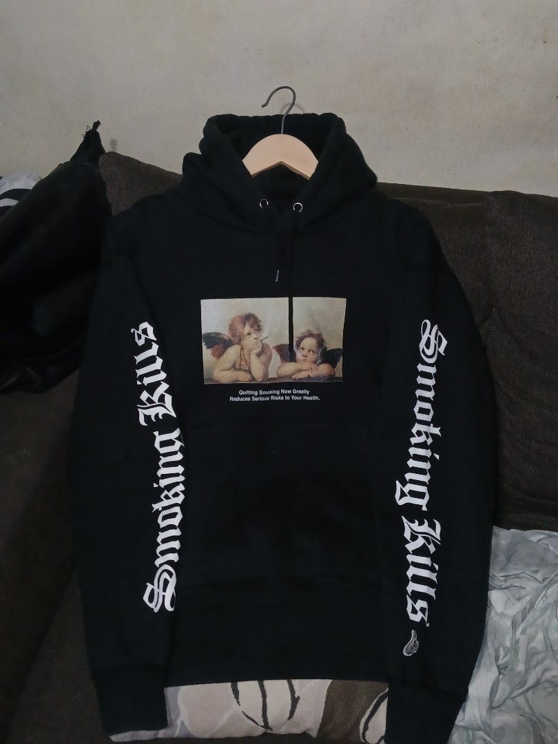 #FR2 Smoking Kills Hoodie (Category: Coats, Jackets and Outerwear) located in Cabuyao City. Submitted by lamperouge11 (Listing ID 1460567333, Image 1). Description: A Heavyweight Hoodie from a Japanese streetwear brand "#FR2" featuring an advocacy regarding smoking. Features: - A graphic of two angels drinking a beer and smoking a ciggarette - A hood adjuster. - An advocacy line "Quitting Smoking Now Greatly Reduces Serious Risks To Your Health "