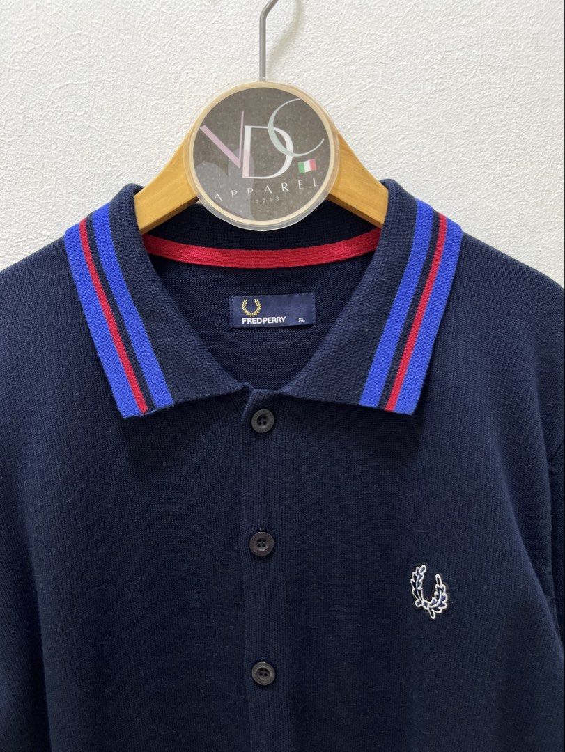 FredPerry Cardigan Knitted (Category: Luxury Apparel) located in Imus. Submitted by vdc.apparel (Listing ID 1460605492, Image 2). Description: This appears to be a navy blue Fred Perry knit polo cardigan featuring a striking red and blue twin-tipped collar. Best fit to Large frame.