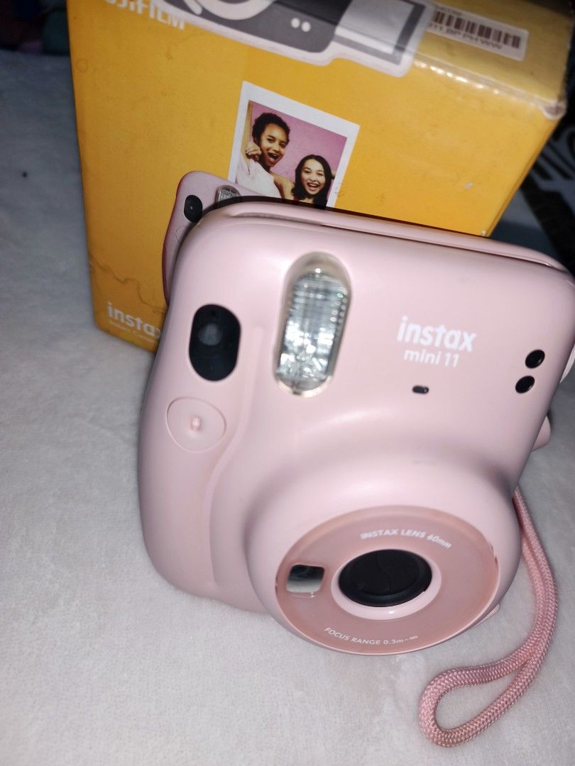 Fujifilm Instax Mini 11 Pink Instant Camera (Category: Cameras) located in Noveleta. Submitted by Rutanyyy (Listing ID 1460655384, Image 1). Description: - Pink Fujifilm Instax Mini 11 Camera - Comes with original box and battery - 60mm lens - Focus range: 0.3m to infinity - Ideal for capturing instant memories - Ready for its next owner -no film included -free alkaline battery.