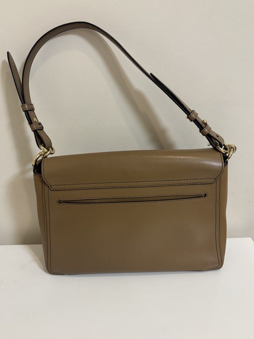 Furla Leather Shoulder Bag (Category: Luxury Bags & Wallets) located in Caloocan City. Submitted by neveroverdressed (Listing ID 1460708398, Image 2). Description: - Genuine Furla brown leather shoulder bag - Secure front flap closure with metal clasp - Convenient back slip pocket - Adjustable strap for comfortable wear - Elegant gold hardware details - Pristine and clean interior - Ideal everyday bag for style and practicality.