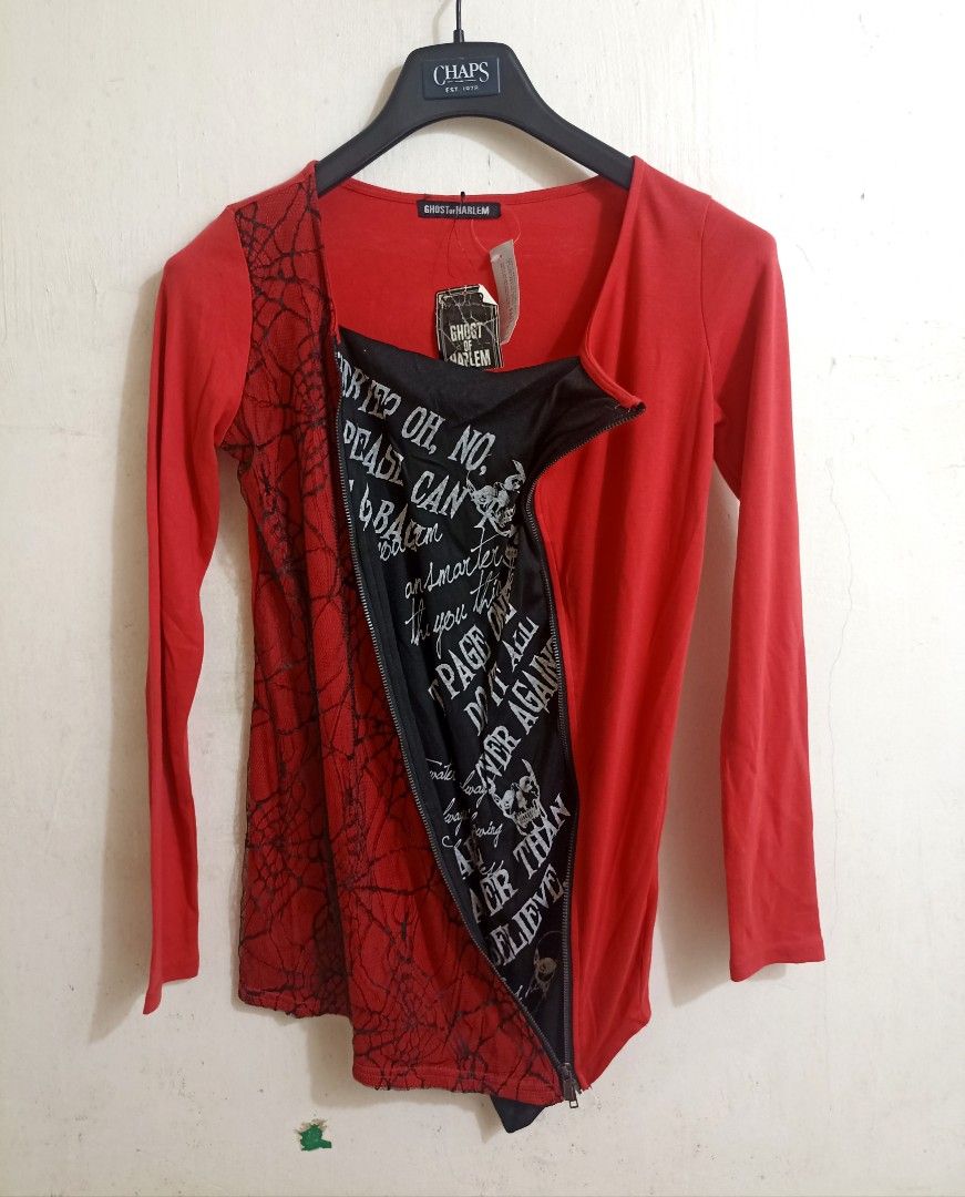 Ghost of Harlem (Category: Longsleeves) located in Davao. Submitted by anythin6 (Listing ID 1460649194, Image 2). Description: - Red long-sleeved top from Ghost of Harlem - Black lace detailing on the left side - Diagonal zip closure on the left - Inner panel with graphic print (skulls and text) - Unique asymmetrical design - Perfect for a statement outfit.