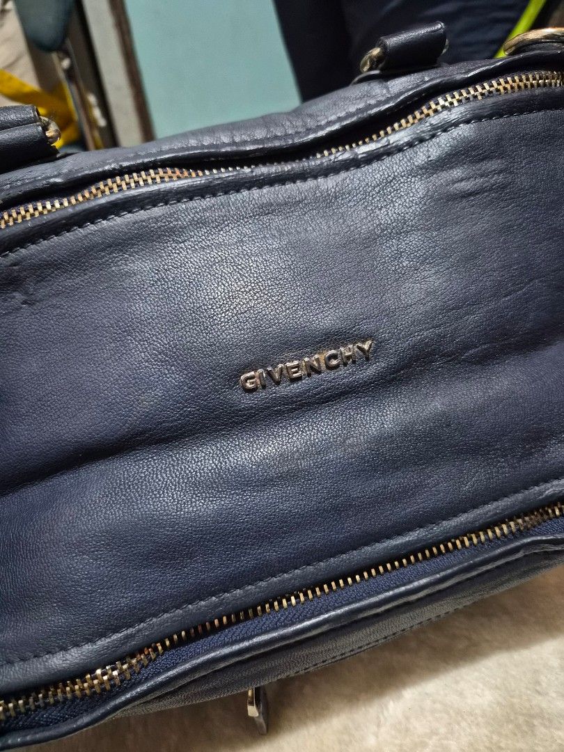 Givenchy pandora Navy Leather Handbag (Category: Other Baby Bathing & Changing Needs) located in Mandaue City. Submitted by chuchi152615 (Listing ID 1460623106, Image 2). Description: - Brand: Givenchy - Color: Navy Blue - Material: Leather - Features: Top handles, detachable crossbody strap - Hardware: Gold-tone - Interior: Spacious, great for everyday essentials - Condition: Used, with some signs of wear on the leather.