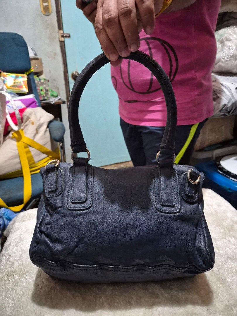 Givenchy pandora Navy Leather Handbag (Category: Other Baby Bathing & Changing Needs) located in Mandaue City. Submitted by chuchi152615 (Listing ID 1460623106, Image 3). Description: - Brand: Givenchy - Color: Navy Blue - Material: Leather - Features: Top handles, detachable crossbody strap - Hardware: Gold-tone - Interior: Spacious, great for everyday essentials - Condition: Used, with some signs of wear on the leather.