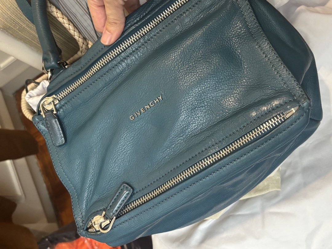 Givenchy Pandora Small Messenger Bag Teal Leather (Category: Luxury Bags & Wallets) located in Makati City. Submitted by u.4.ria (Listing ID 1460517106, Image 2). Description: - Authentic Givenchy Pandora Bag - Color: Teal Blue - Size: Small - Material: goatskin Leather - Features: Top handles, detachable shoulder strap, multiple zippered compartments Note: I bought my Givenchy Small Pandora Sugar goatskin in Teal at Barneys New York (Madison Ave