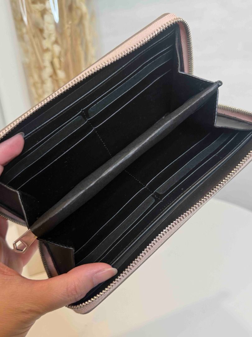 Givenchy Paris Zip Around Wallet Pink Leather (Category: Wallets & Card holders) located in Las Pinas. Submitted by happystar_cac724 (Listing ID 1460602603, Image 3). Description: - Authentic Givenchy Paris pink leather wallet - Zip-around closure for security - Bold Givenchy Paris logo on the front - Spacious interior with multiple card slots and compartments - Ideal for keeping your essentials organized.