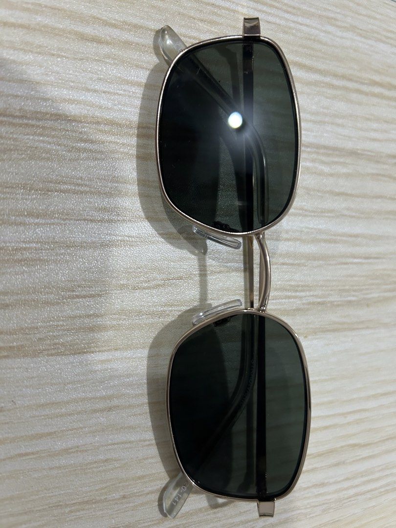 Gold Frame Square Sunglasses (Category: Sunglasses & Eyewear) located in Quezon City. Submitted by pinkisswear (Listing ID 1460693535, Image 3). Description: - Gold frame square sunglasses - Dark lenses for sun protection - Clear plastic arms - Clip-on design, ideal for attaching to existing eyeglasses.