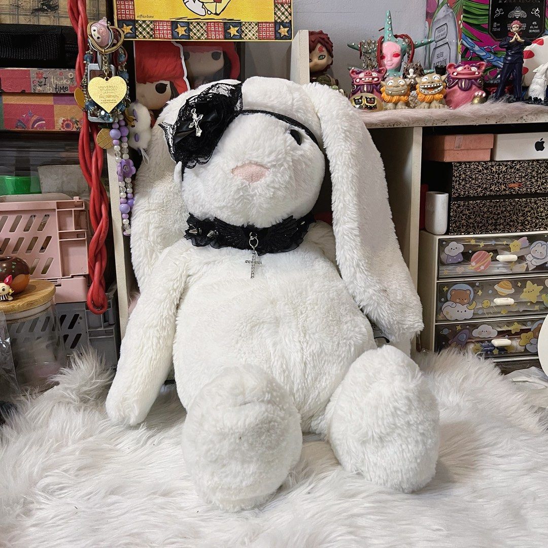 goth bunny plush (Category: Plushies & Soft Toys) located in Malolos. Submitted by babebunzz (Listing ID 1460699570, Image 1). Description: - Super soft white bunny plush - Adorned with a black lace choker featuring a cross charm - Wears a cute eyepatch with a bow and cross detail - Ideal for plush collectors or as a unique decor item - Looking for a new loving home.