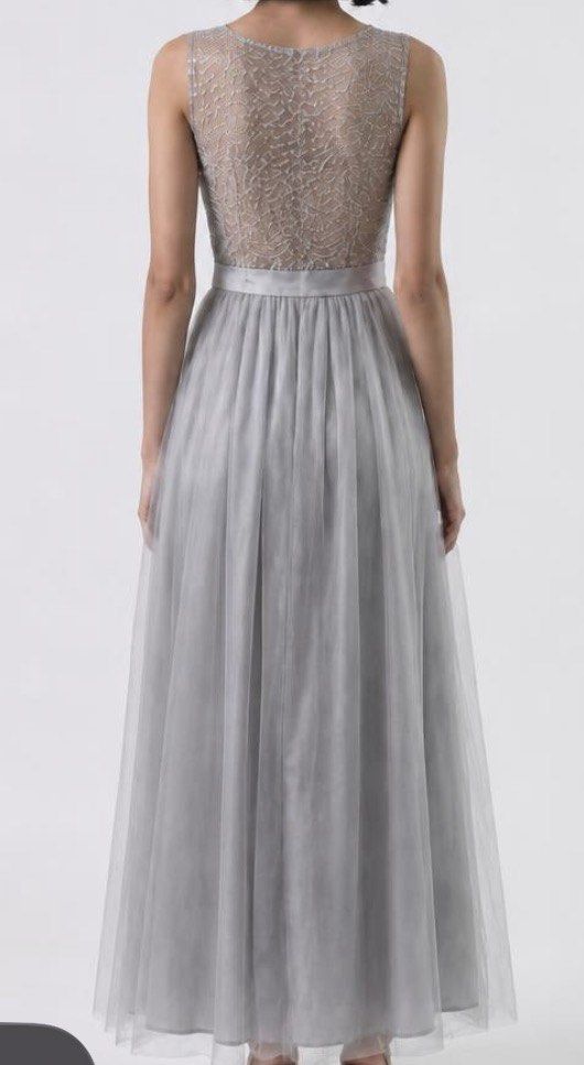 Gray long dress (Category: Evening dresses & gowns) located in San Juan City. Submitted by cometsanythingtosell (Listing ID 1460538555, Image 2). Description: Long dress with shiny accent.