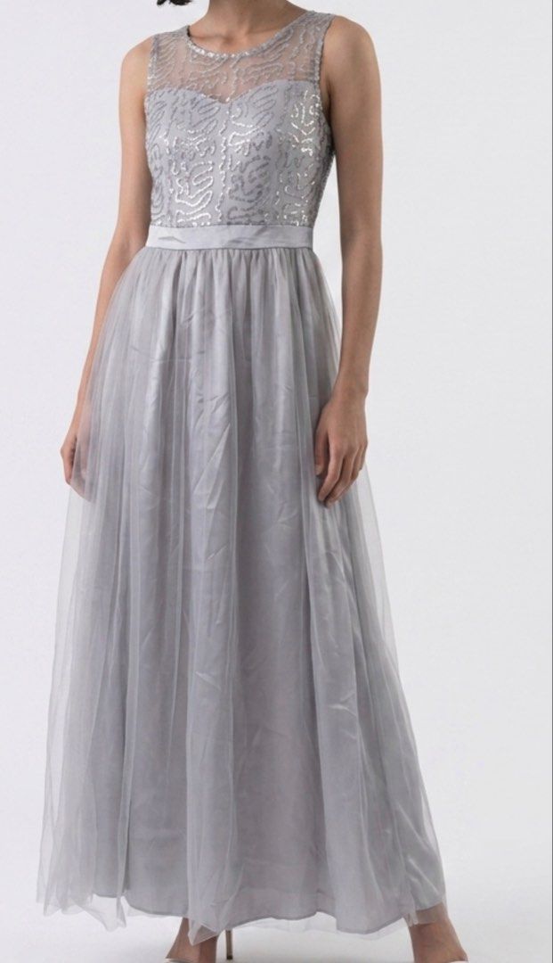 Gray long dress (Category: Evening dresses & gowns) located in San Juan City. Submitted by cometsanythingtosell (Listing ID 1460538555, Image 1). Description: Long dress with shiny accent.