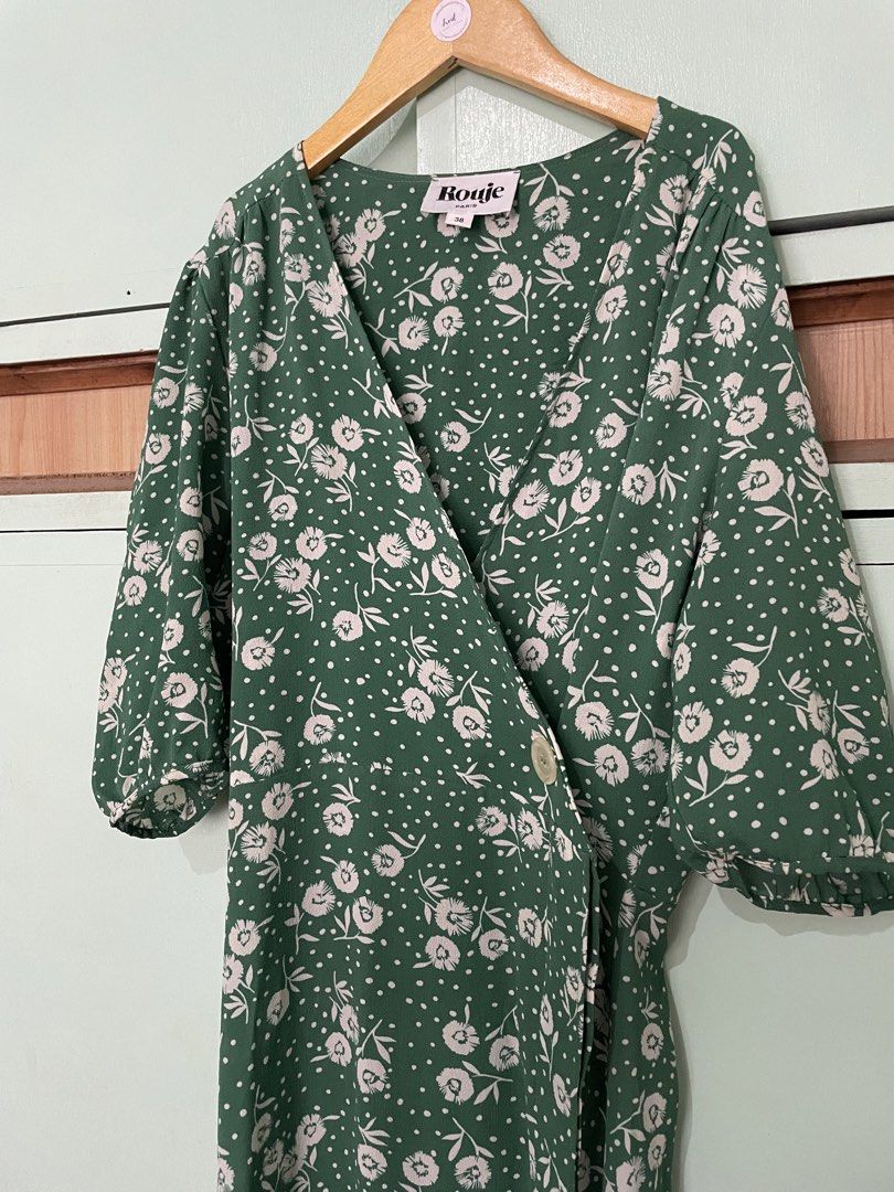 Green Floral Wrap Midi Dress (Category: Dresses) located in Caloocan City. Submitted by heybhaneyy (Listing ID 1460529201, Image 2). Description: - Green midi dress - White floral and polka dot print - Flattering wrap style - Side button closure - Puff sleeves - Midi length with a slit - Very flattering fit!.